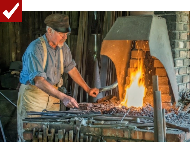 Man forging weapons in fire